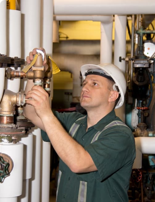 Steam system technician at work